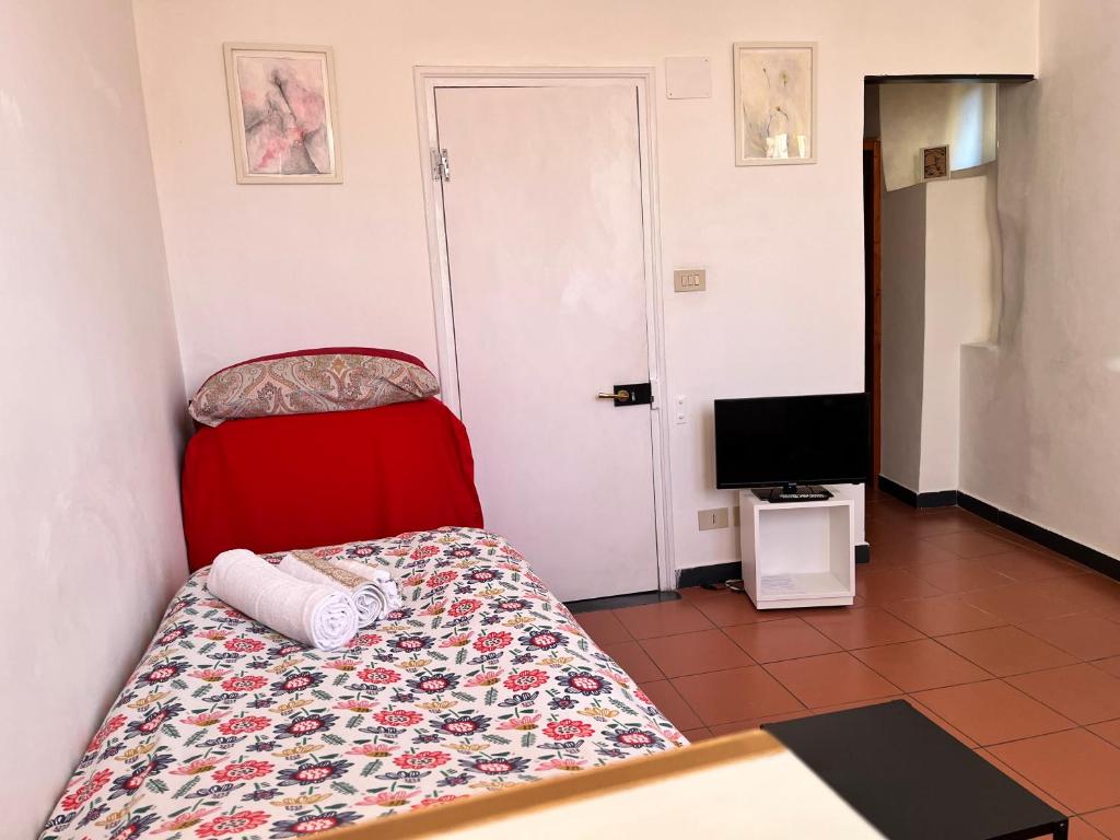 Postel nebo postele na pokoji v ubytování B&B Ligustico
