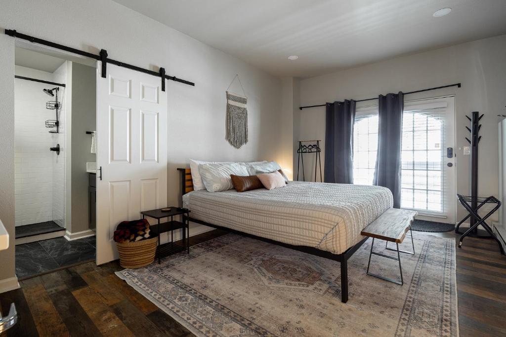 a bedroom with a large bed and a door at Winter Park Chateau in Winter Park