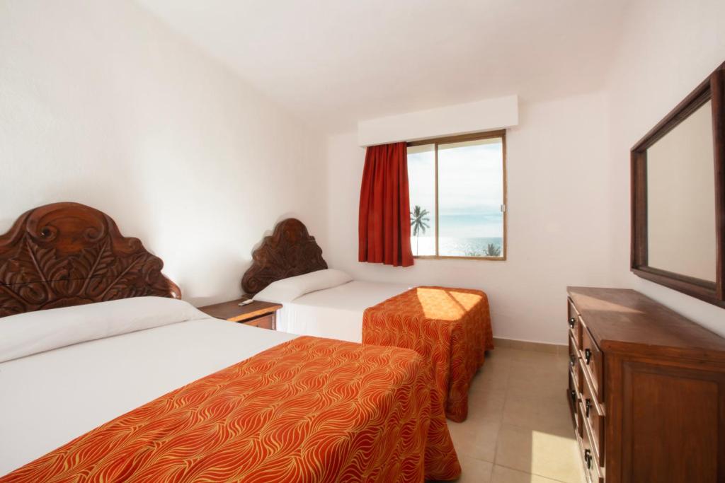 Postel nebo postele na pokoji v ubytování Costa Club Punta Arena - Desayuno buffet incluido