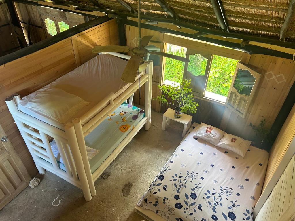 an overhead view of a bedroom with a bunk bed at Nature Harmony Retreat in Tierra Bomba - Your Sustainable Escape in Cartagena de Indias