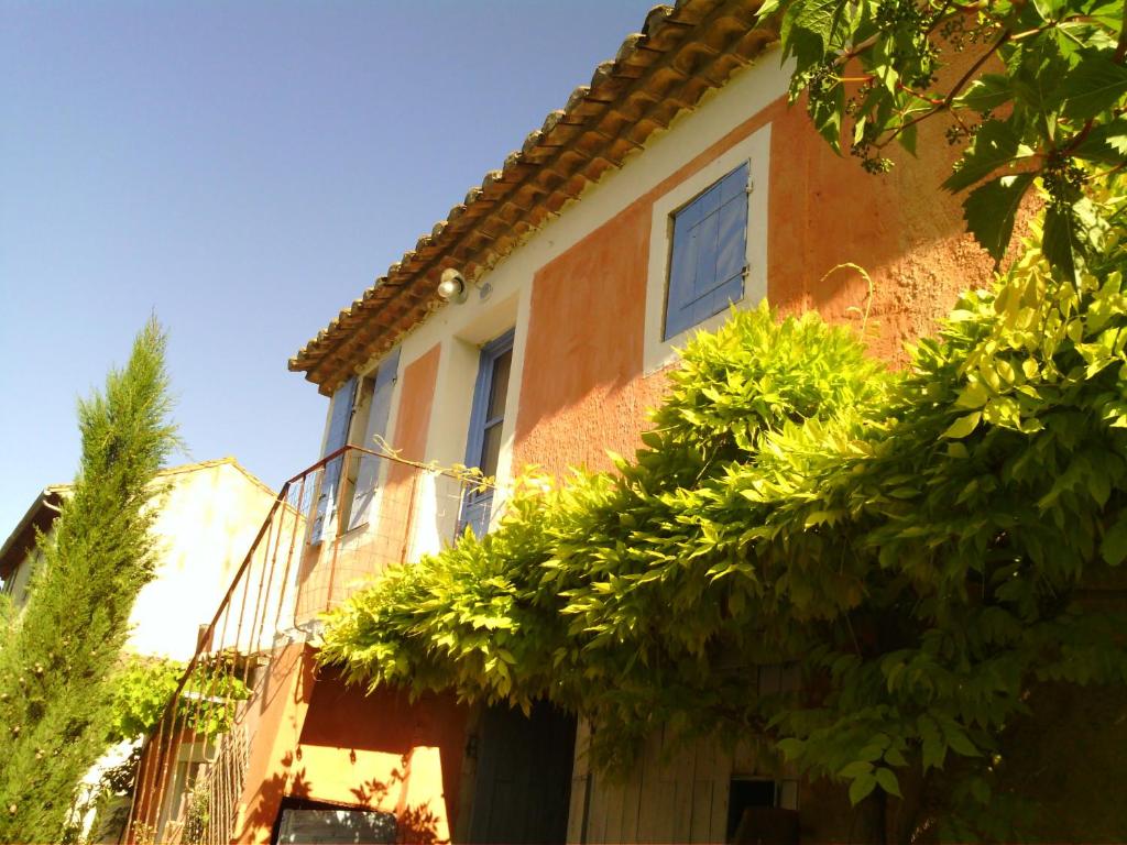 a house with trees in front of it at Mas Valentine in Roquemaure