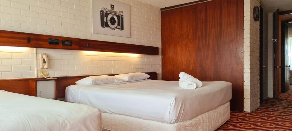 Postel nebo postele na pokoji v ubytování Indian Ocean Hotel