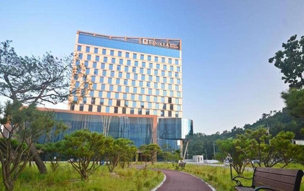 a large building with a road in front of it at Benikea hotel seosan in Seosan