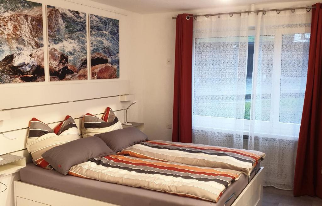 Postel nebo postele na pokoji v ubytování Casa Laudinella 2,5 Zimmer