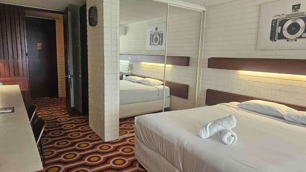 Postel nebo postele na pokoji v ubytování Indian Ocean Hotel
