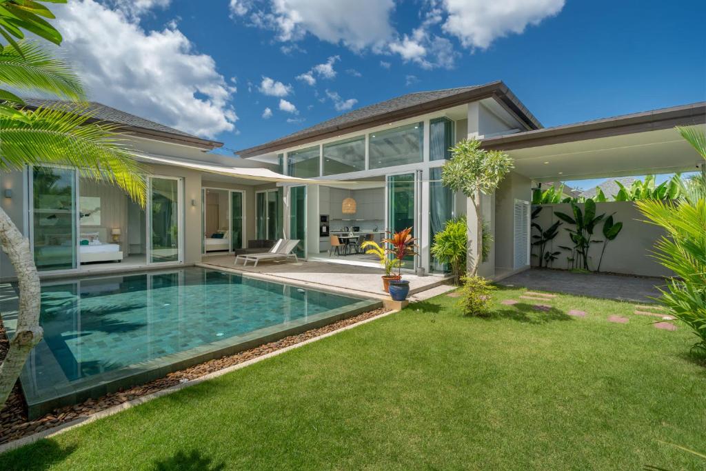 an image of a house with a swimming pool at Peykaa Estate Pool Villa by HCR in Phuket Town