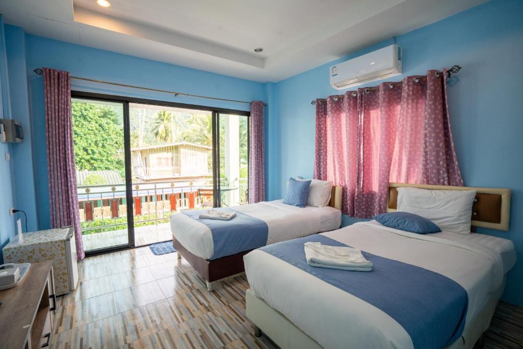Postel nebo postele na pokoji v ubytování Janpa Resort