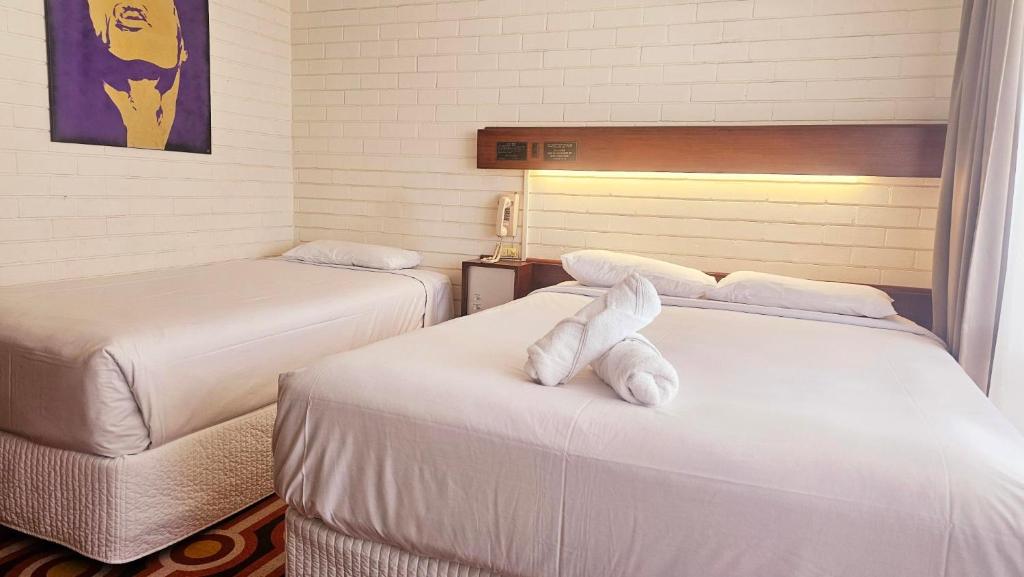 Postel nebo postele na pokoji v ubytování Indian Ocean Hotel