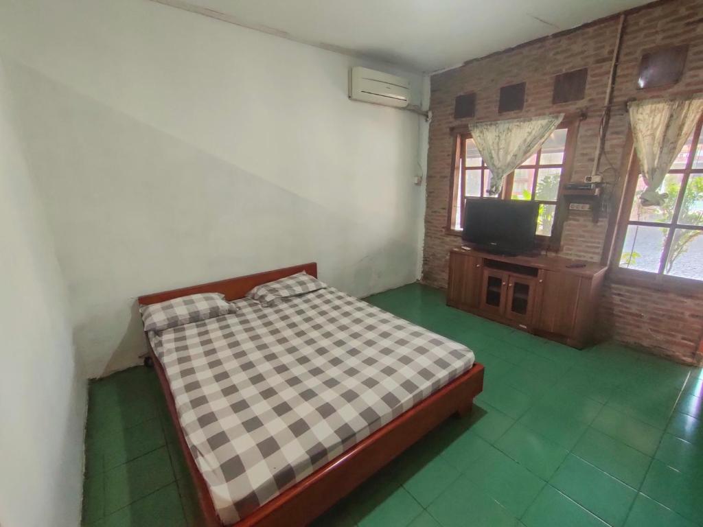 Postel nebo postele na pokoji v ubytování Lucia Cottages