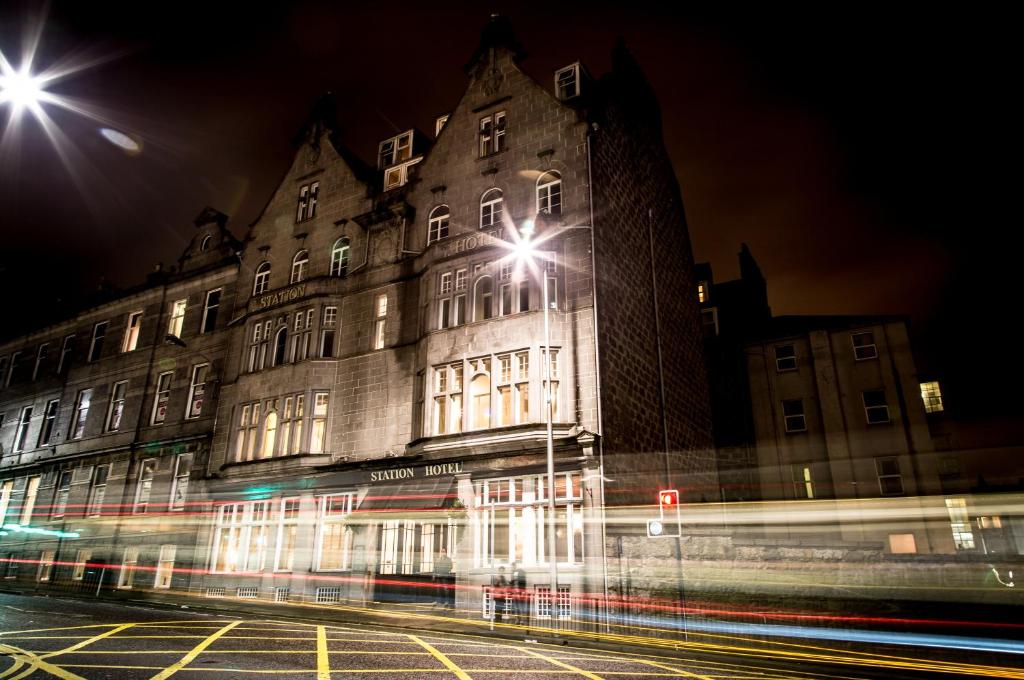 a building with a street light in front of it at The Station Hotel in Aberdeen