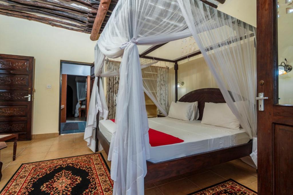 Letto o letti in una camera di Diani Beach-Villa Kirsch