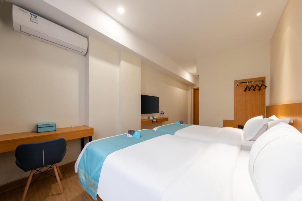 Postel nebo postele na pokoji v ubytování Xana Lite Hotel - Guangzhou Fangcun Huadiwan Metro Station