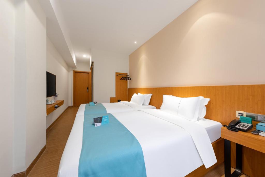 Postel nebo postele na pokoji v ubytování Xana Lite Hotel - Guangzhou Fangcun Huadiwan Metro Station