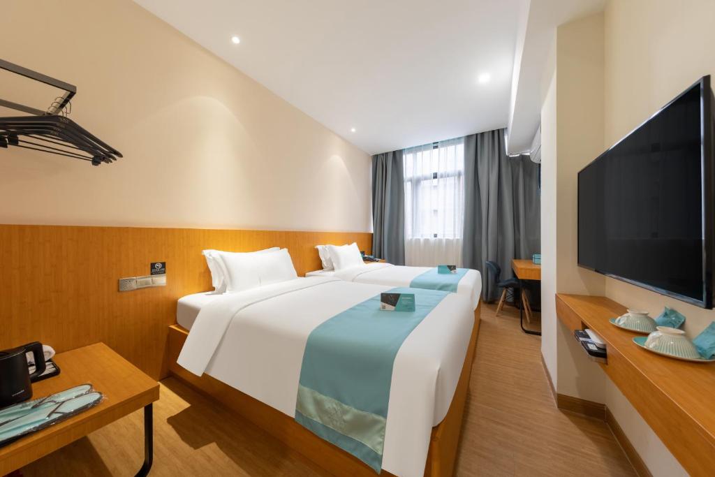TV a/nebo společenská místnost v ubytování Xana Lite Hotel - Guangzhou Fangcun Huadiwan Metro Station