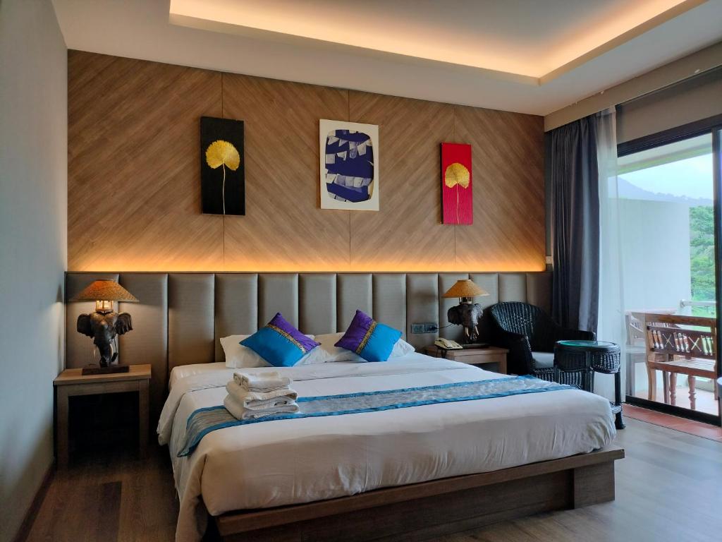 a bedroom with a large bed in a room at Chang Buri Resort & Koh Chang Hillside in Ko Chang