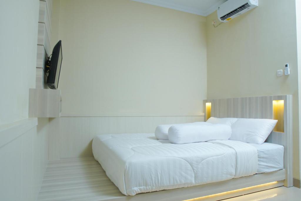 Cama o camas de una habitación en Kost Eksklusif Teduh