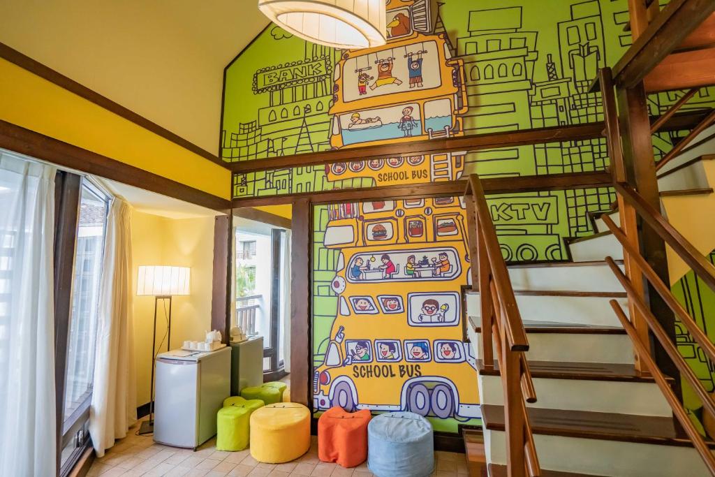 a childs room with a mural of a bus at Yoho Beach Resort Kenting in Hengchun