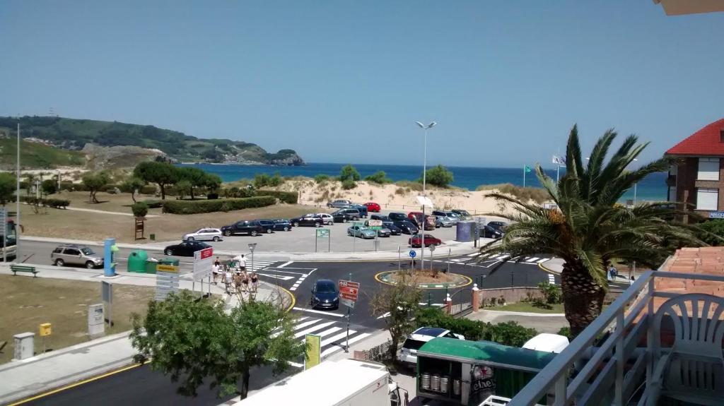 a view of a parking lot next to the ocean at Pensión Dorada in Noja