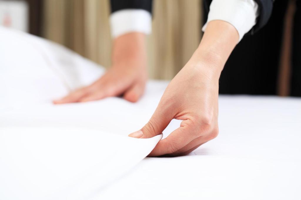 Postel nebo postele na pokoji v ubytování FOX Hotel Glenmarie Shah Alam