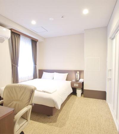 Postel nebo postele na pokoji v ubytování Bande Hotel Osaka