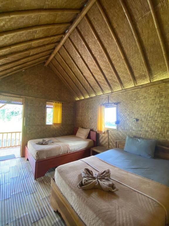 Postel nebo postele na pokoji v ubytování EDRIAN BUNGALOWS