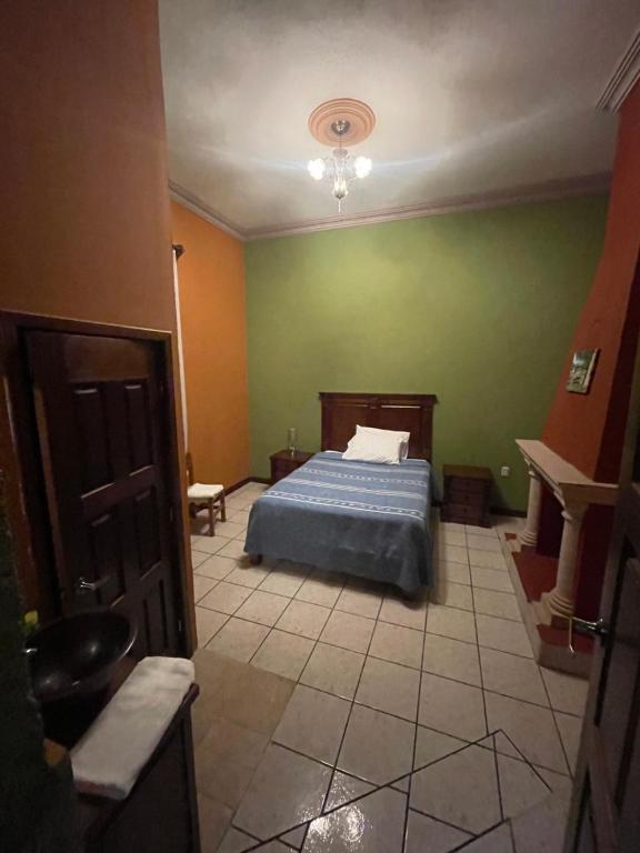 Postel nebo postele na pokoji v ubytování HOTEL PUEBLO GRANDE