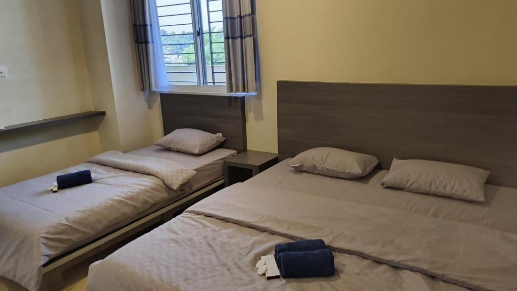 Postel nebo postele na pokoji v ubytování SleepRest @ NTC