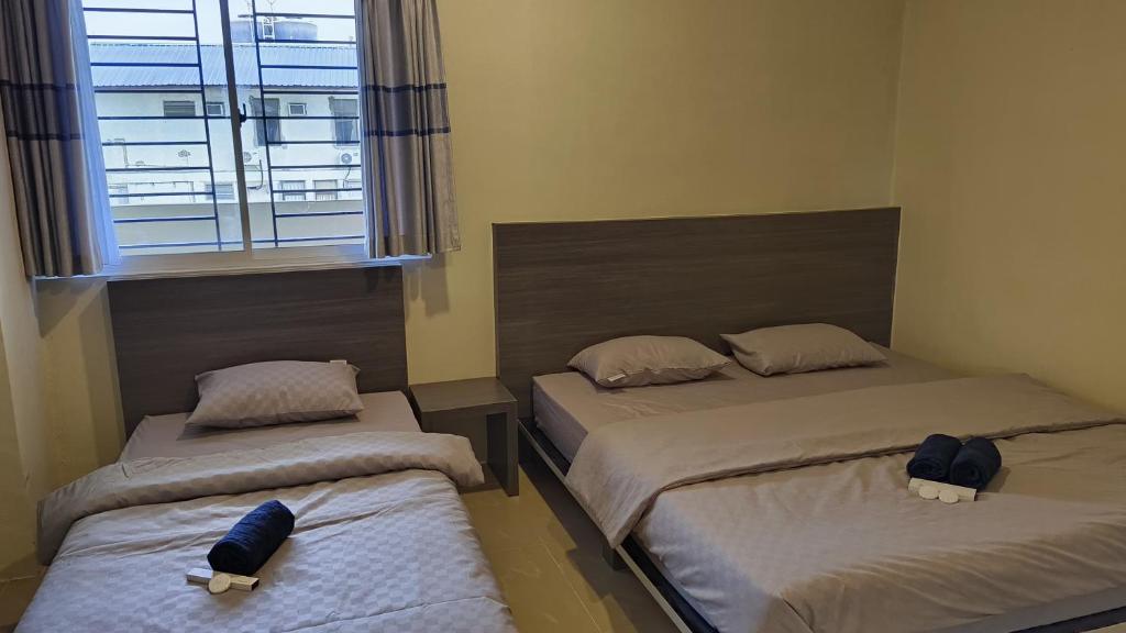 Postel nebo postele na pokoji v ubytování SleepRest @ NTC