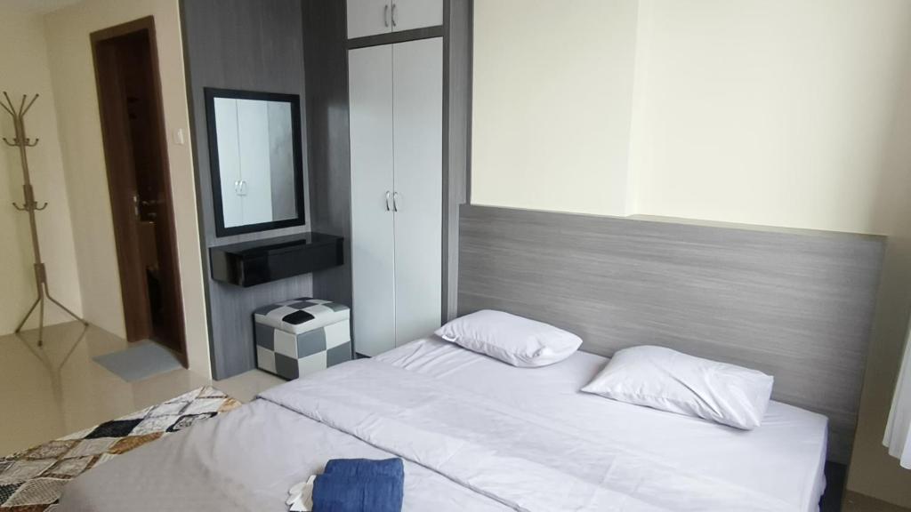Postel nebo postele na pokoji v ubytování SleepRest @ NTC