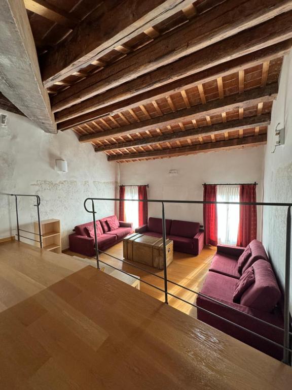 a living room with two couches and a table at Campus San Francesco in Conegliano