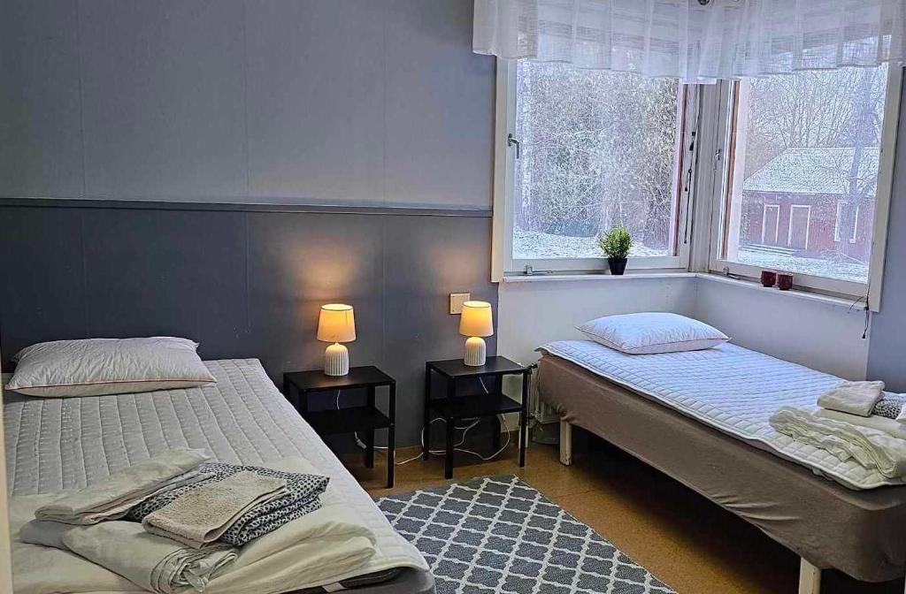 Postel nebo postele na pokoji v ubytování Näsbygården