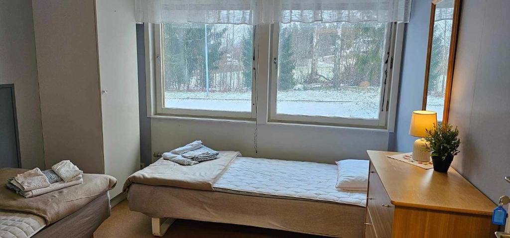 Postel nebo postele na pokoji v ubytování Näsbygården