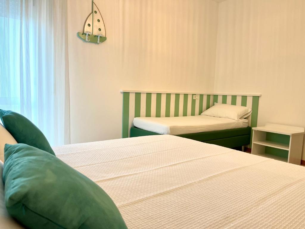 Postel nebo postele na pokoji v ubytování Hotel Acquario