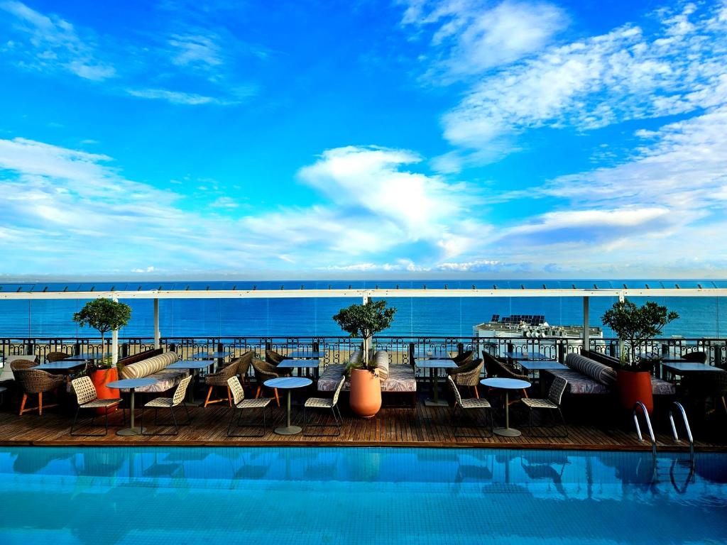 a swimming pool on the roof of a building at Dar El Marsa Hotel & Spa in La Marsa