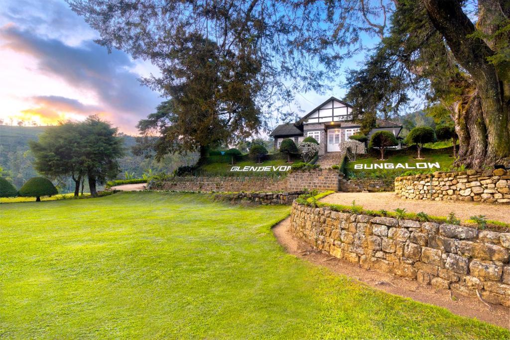a stone wall in front of a house at Scottish Planter Bungalow- Thema Collection in Nuwara Eliya