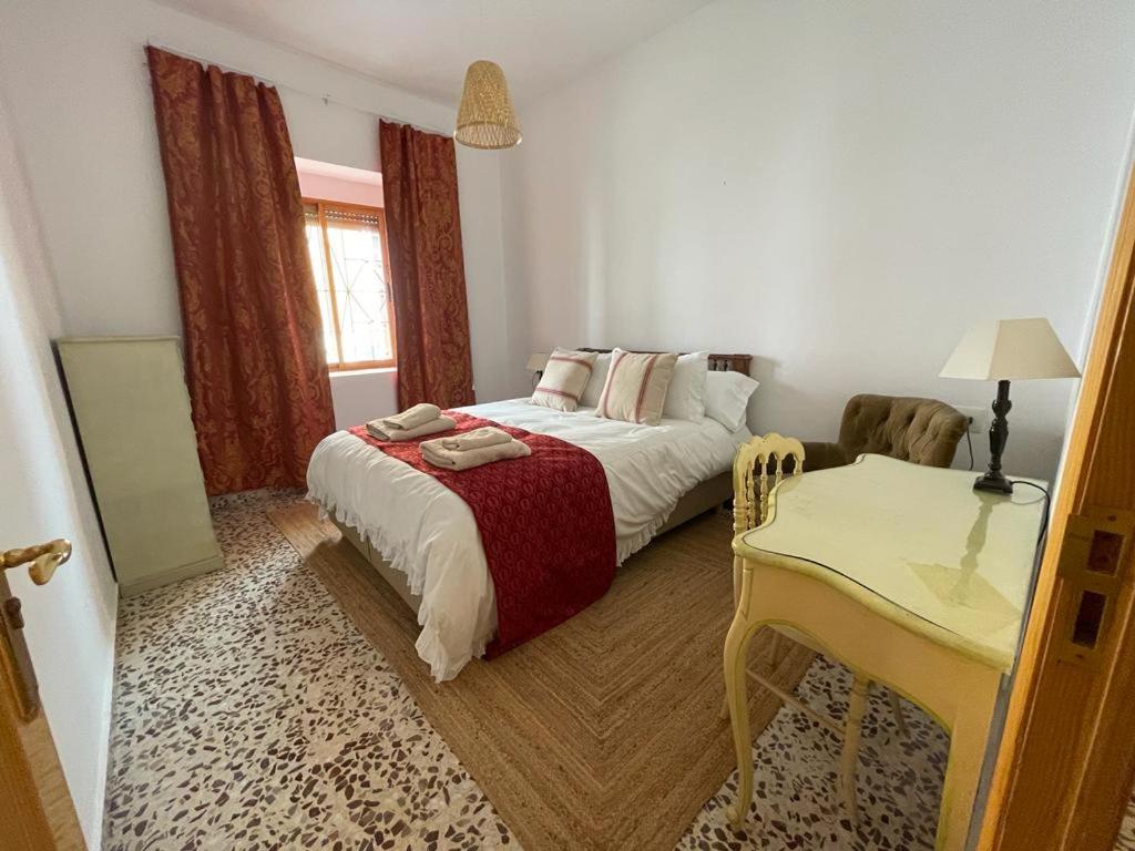 מיטה או מיטות בחדר ב-Las Cocheras del Marqués