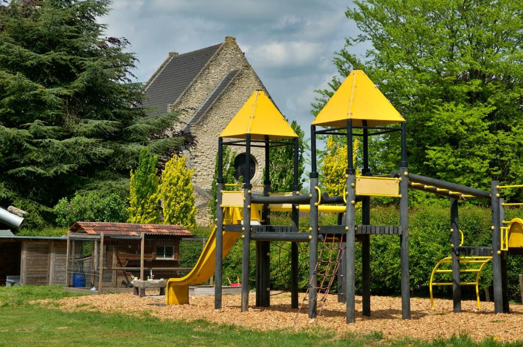 a playground with a slide in a park at Camping La Dolce Vita in Ransdaal
