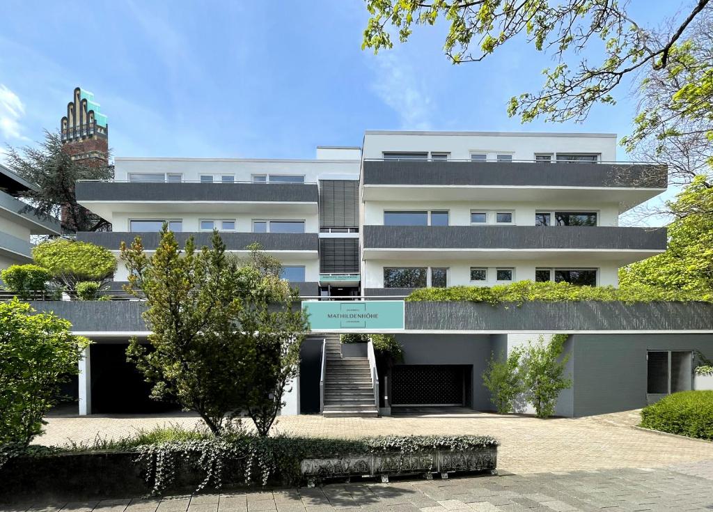 an exterior view of a white building at Livingroom Mathildenhöhe in Darmstadt