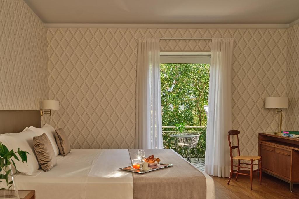 Кровать или кровати в номере Grand Hotel Miramare