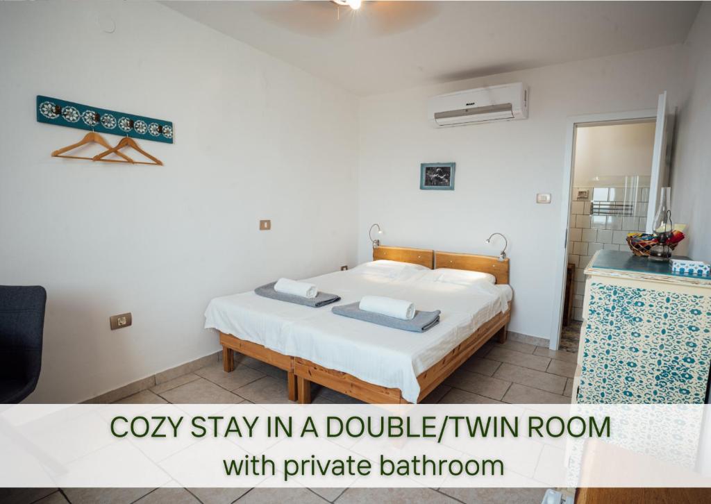 Postel nebo postele na pokoji v ubytování Guesthouse Kamniti Rob