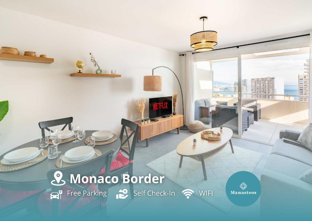 a living room with a table and a couch at Large terrace, sea view, 5mn Monaco, free parking in Beausoleil