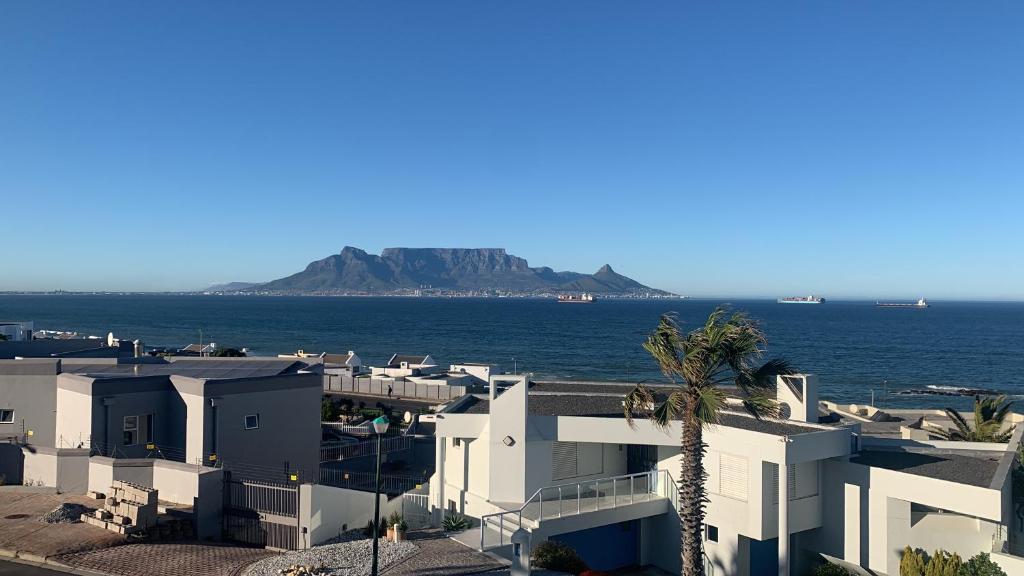 a view of the ocean from a building at Blouberg by the Sea in Cape Town
