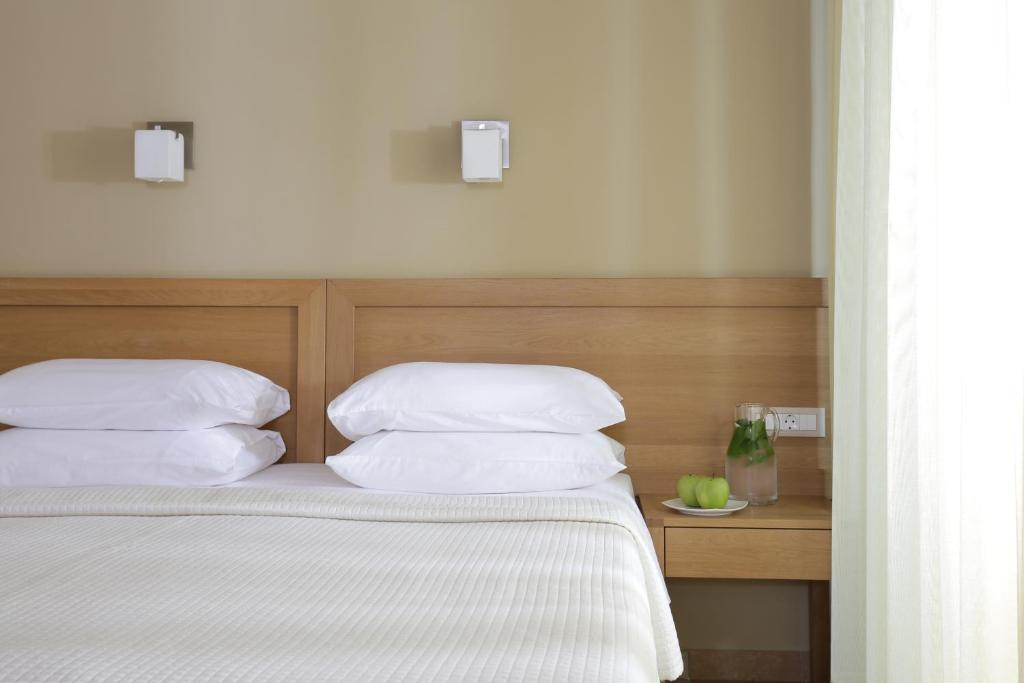 Postel nebo postele na pokoji v ubytování Almira Hotel