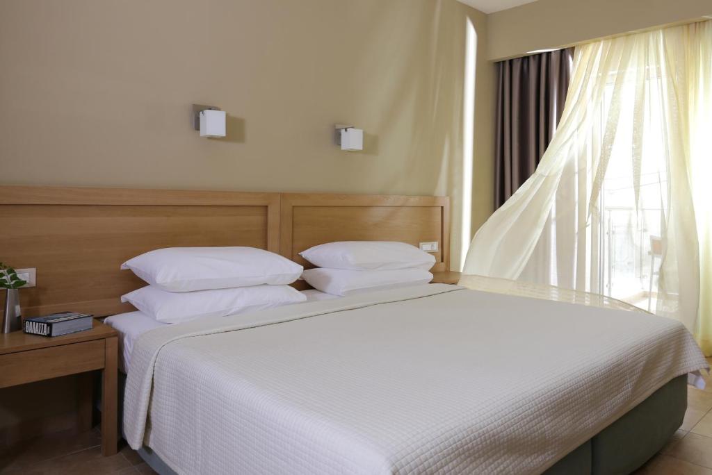 Postel nebo postele na pokoji v ubytování Almira Hotel