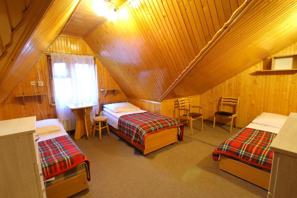 Postel nebo postele na pokoji v ubytování Willa Borowik