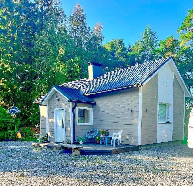 a small house with a porch and a table at Vaasa homestay in Vaasa