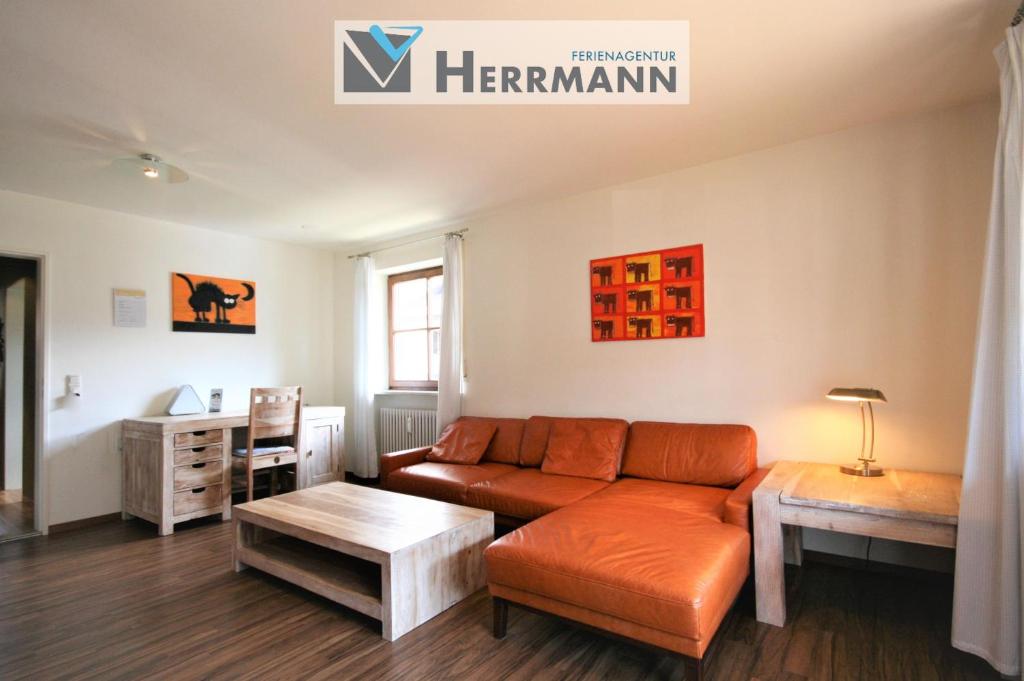 a living room with a couch and a table at Ferienwohnung Steuer in Füssen