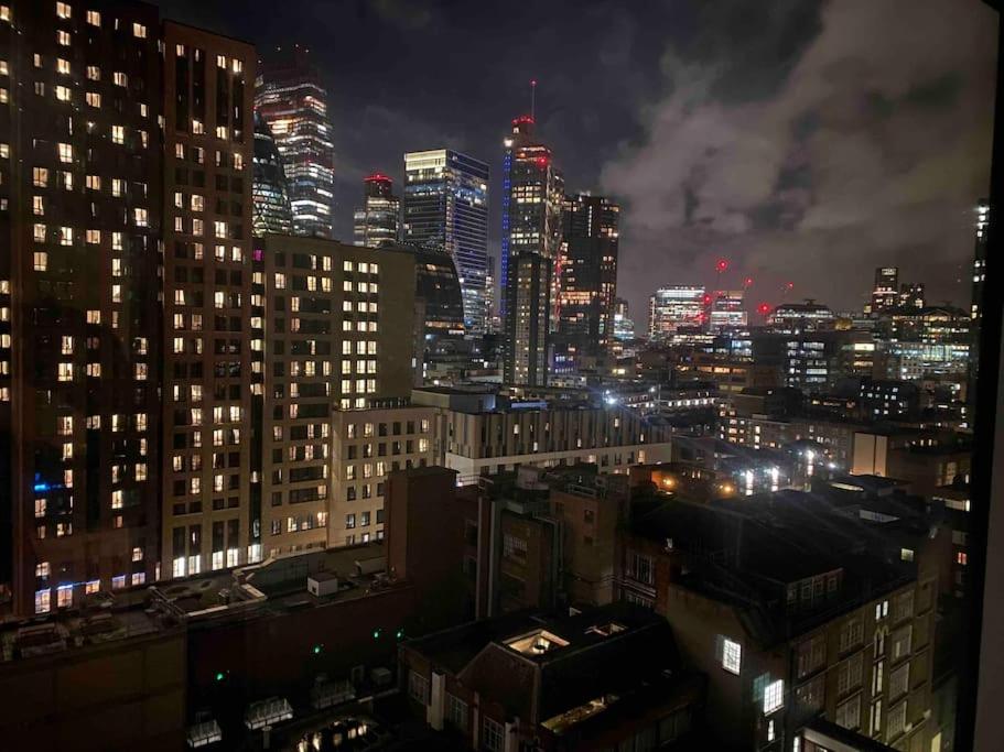 a view of a city at night with lights at Skyline View - City of London. in London