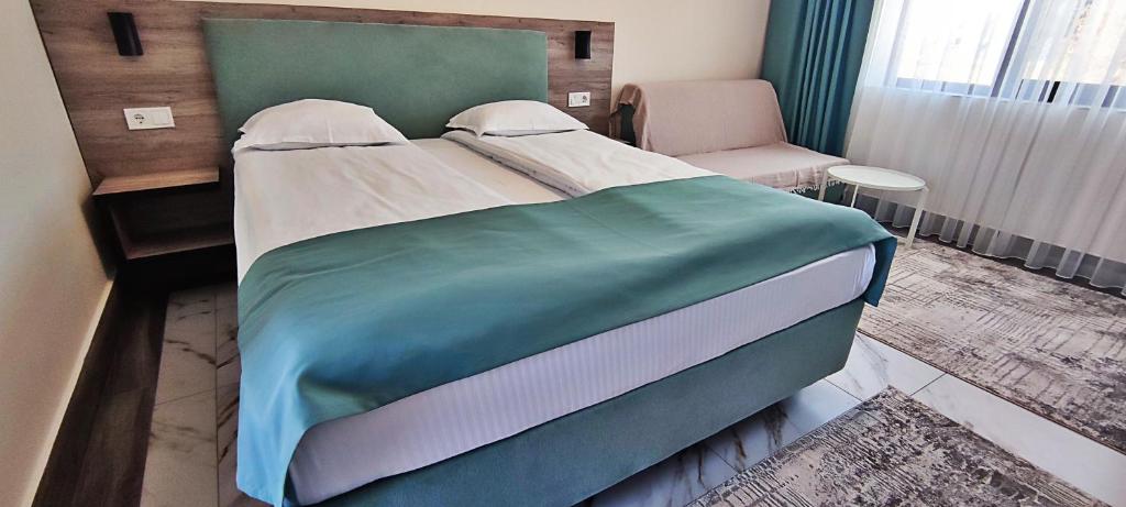 Postel nebo postele na pokoji v ubytování Makaza Complex