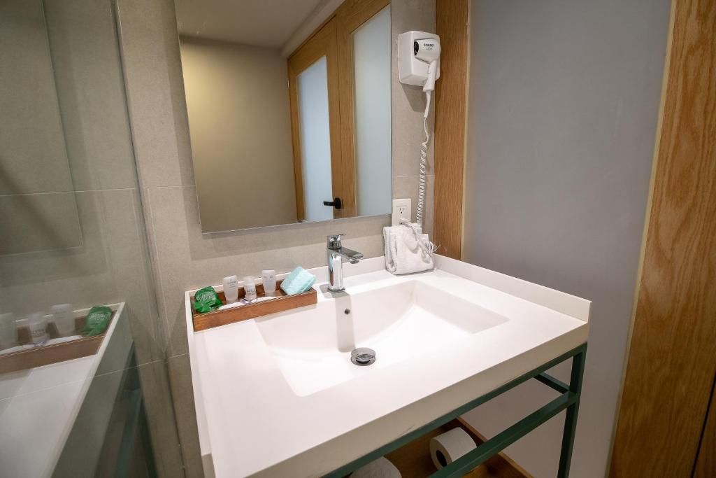 Koupelna v ubytování Oliva Plaza Hotel